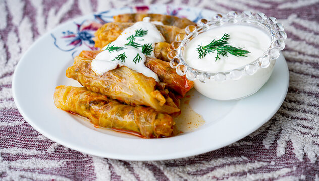 Stuffed cabbage roll with yoghurt sauce and fresh dill, traditional turkish food