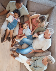 Family relax, generations and love in home with happy parents, grandparents and children on sofa bonding in overhead. Happy family, together and spending quality time with smile in living room.