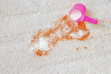 Uses of bleaching powder a white carpet indoors. Cleaning. closeup. - obrazy, fototapety, plakaty