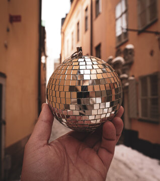 disco ball in the hands