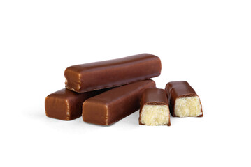 Pile of chocolate candy with milk praline filling on a white background.