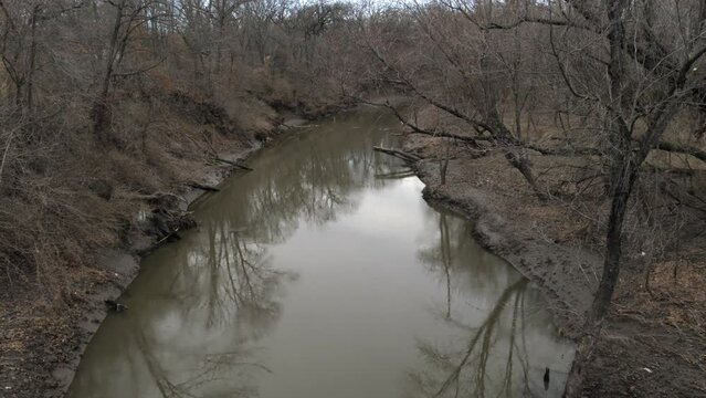 Reflections on the Slow Flowing Blue River