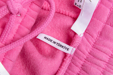 Obraz na płótnie Canvas Label of pink sport trousers or sweatshirt. 