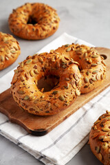 Homemade Pumpkin Seed Bagels Ready to Eat, side view.