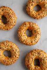 Homemade Pumpkin Seed Bagels Ready to Eat, top view. From above, overhead, flat lay.