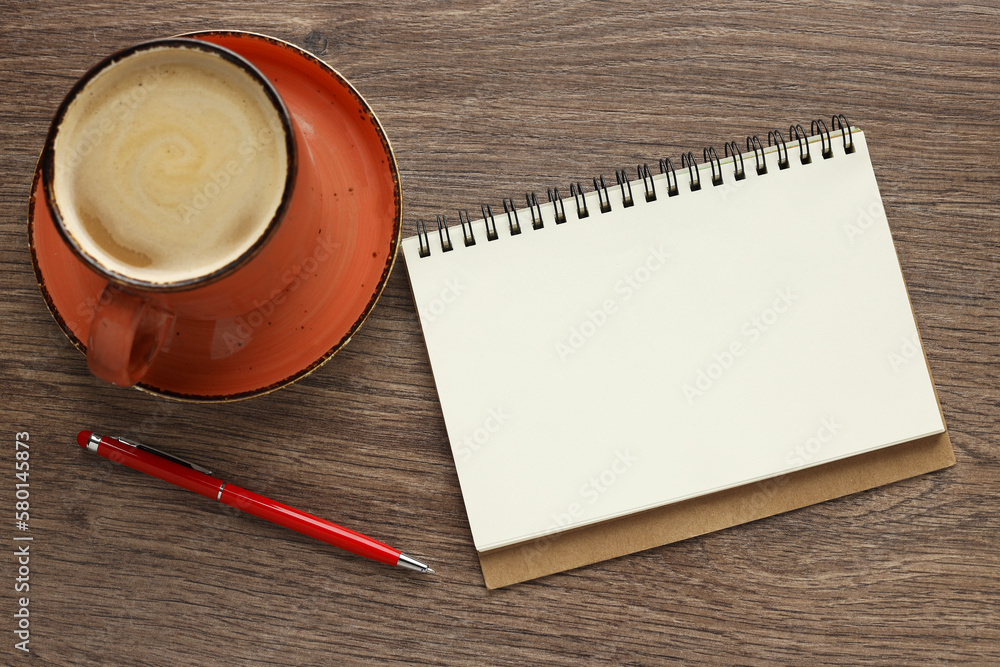 Poster modern office desk with notepad and coffee cup. blank notepad page for entering text in the middle. 