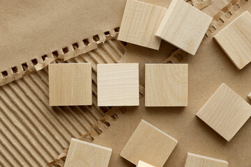 Three stacked geometric wooden cube blocks. isolated on paper background.
