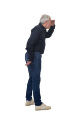 Naklejka premium side view of standing man looking with hand on forehead on white background