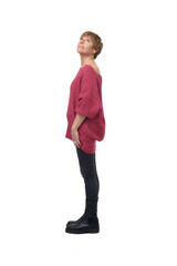 side view of full length portrait of  woman looking up on white background