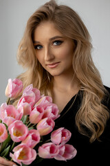 Fototapeta premium portrait of a woman with pink flowers