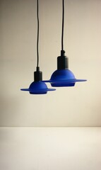 Cobalt blue hanging glass lamps. UFO shaped design from the 1980s.