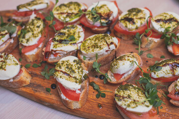 Office party catering, table with variety of different food snacks on a workplace, sandwiches, croissants and appetizers on a party event or celebration, coffee break for colleagues and employees