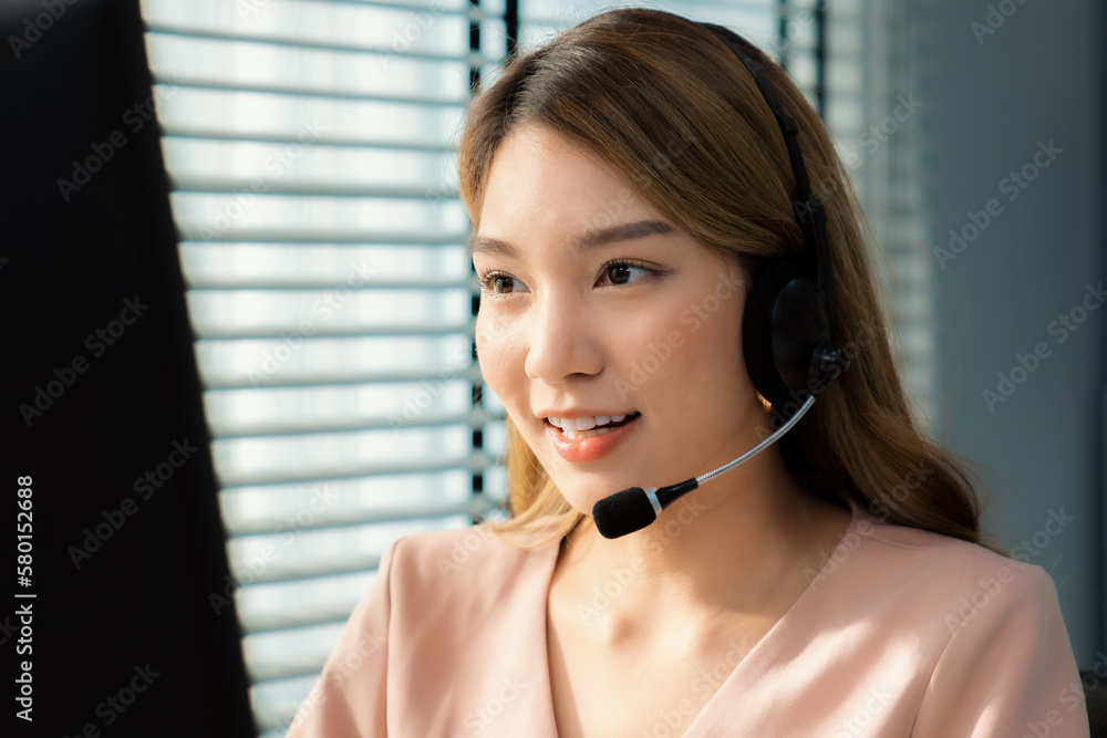 Aufkleber competent female operator working on computer and while talking with clients. concept relevant to bo