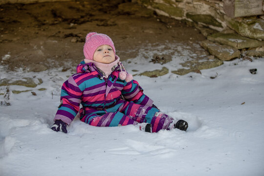 A little girl enjoys the sunny and cold winter wonderland of the north.