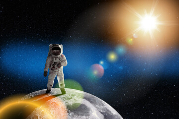 Astronaut at the spacewalk on the moon. National Moon Day. Space Exploration Day. Elements of this image furnished by NASA.