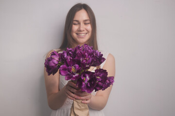 girl with tulips on a white background