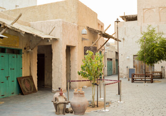 Narrow streets that create shade on a hot day in the old city of Dubai Creek and Bur district. Travel destinations and heritage village