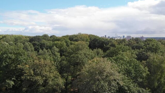 Aerial shot of Fredenbaumpark with Dortmund dowmtown in view, Germany.
