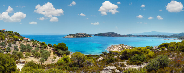 Beautiful summer Aegean Sea coast landscape with Lagonisi beach, Sithonia, Halkidiki, Greece. People are unrecognizable.