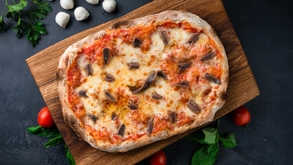 Italian pinza or pizza with cheese and beef slices.