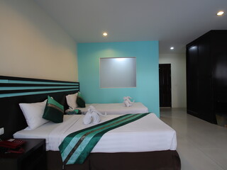Decorated single bedroom with bed nice colours