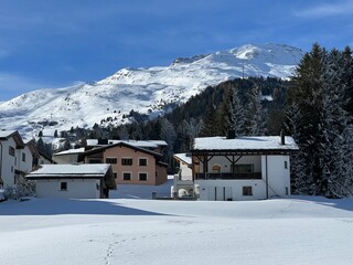 Swiss alpine holiday homes, mountain villas and holiday apartments in the winter ambience of the tourist resorts of Valbella and Lenzerheide in the Swiss Alps - Canton of Grisons, Switzerland (Schweiz