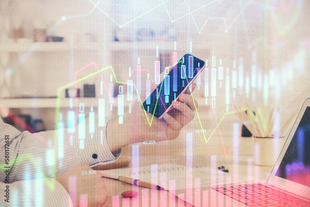 Poster double exposure of man's hands holding and using a digital device and forex graph drawing. financial