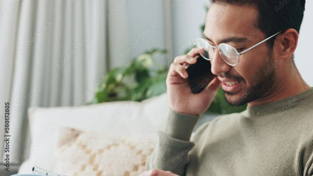 Wall mural Phone, tablet and communication with a man talking on a call and browsing the internet on a sofa in the living room of his home. Social media, networking and laugh with a male having a conversation