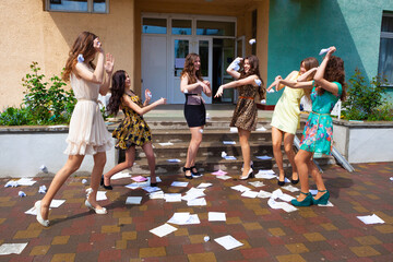 happy female students after passing final exams