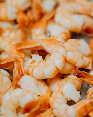 shrimps are fried in a sauce in a pan