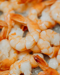shrimps are fried in a sauce in a pan