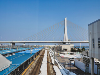 Aomori, Japan - March 8, 2023: Aomori Bay bridge on blue sky background
