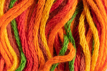 A close up view of shades of orange threads provides inspiration for arts and craft projects.