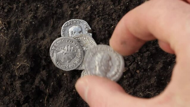 Ancient Roman silver coin with portrait of emperor