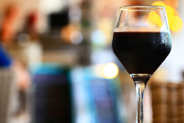 a glass of red wine in a luxurious background restaurant