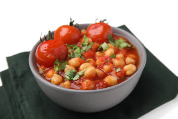 Delicious chickpea curry in bowl and dark cloth on white background, closeup