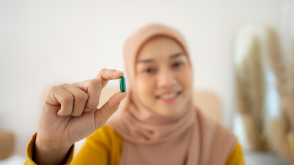 Diet, nutrition, healthy eating concept. Close Up Of Happy Smiling Asian Woman Taking Supplement...