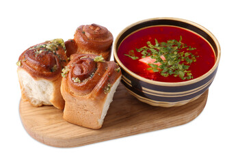 Tasty fresh pampushky and borsch. Traditional Ukrainian buns with garlic and beet soup isolated on white