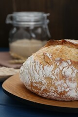 Freshly baked bread on blue wooden table