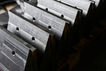 Processed metal plates with ground edges in warehouse