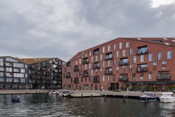 Naklejka premium Outdoor exterior view of modern design apartment and residential building on the waterside in Copenhagen, Denmark. 