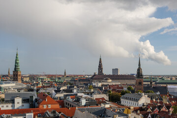 Naklejka premium Aerial panoramic outdoor scenery view over Copenhagen, Denmark after raining with background of rainbow. 