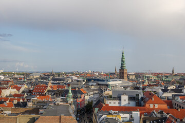 Naklejka premium Aerial panoramic outdoor scenery view over Copenhagen, Denmark after raining with background of rainbow. 