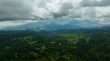 Mountain landscape with mountain peaks covered with forest. Negros, Philippines