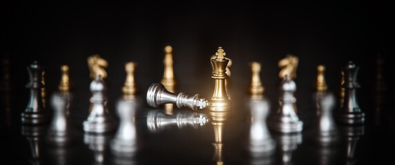 King chess pieces on falling chess with graphic icons concepts of leadership or wining to challenge or battle fighting of business team player and strategy and risk management or human resource.