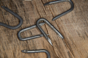 pile of heavy barbed wire staples for construction and carpentry