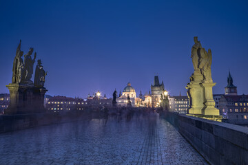 Charles Bridge, Prague at dramatic evening, Czech Republic, with night lighting