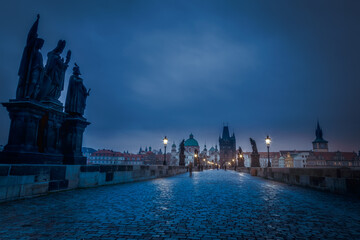 Charles Bridge, Prague at dramatic evening, Czech Republic, with night lighting