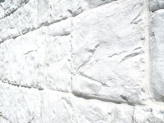 A white brick wall, The bricks are uniform in size and shape, arranged in a traditional brick bond...