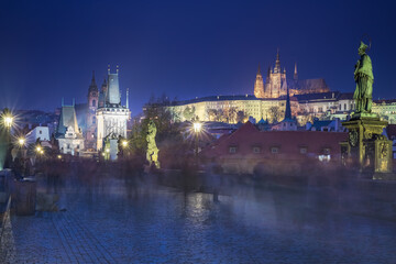 Charles Bridge, Prague at dramatic evening, Czech Republic, with night lighting